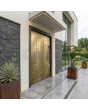 Aluminum hinged entry door with yellow brass texture of milled metal